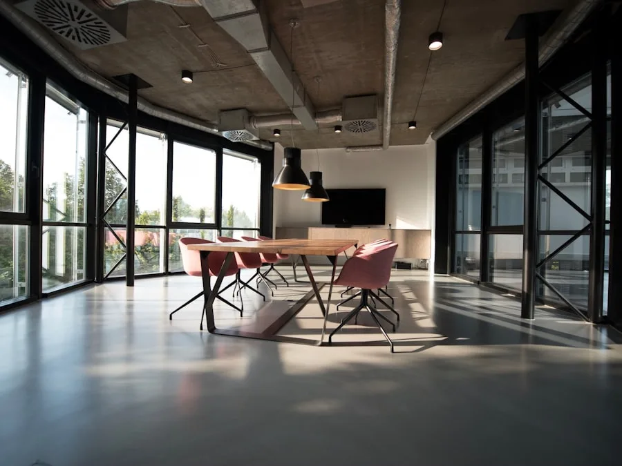 Empty office corridor with glass rooms and daylight